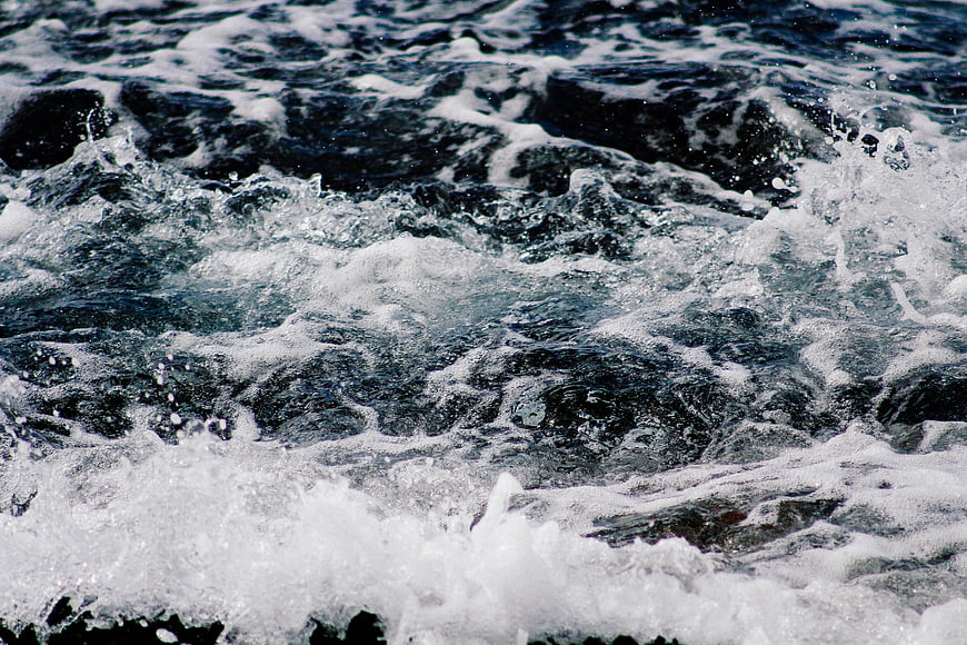 Close-up of turbulent ocean waves with white foam