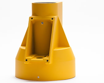 Yellow industrial metal component on white background