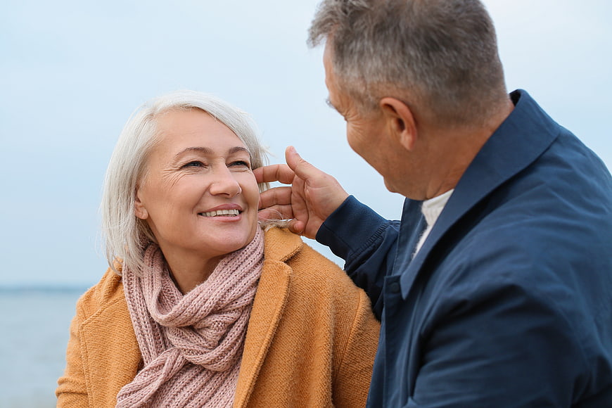 Senior couple sharing a tender moment outdoors