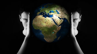 Conceptual man holding 3D globe of Africa and Europe in dark space