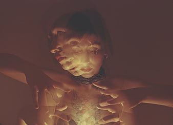Mystical woman with double exposure face and hands