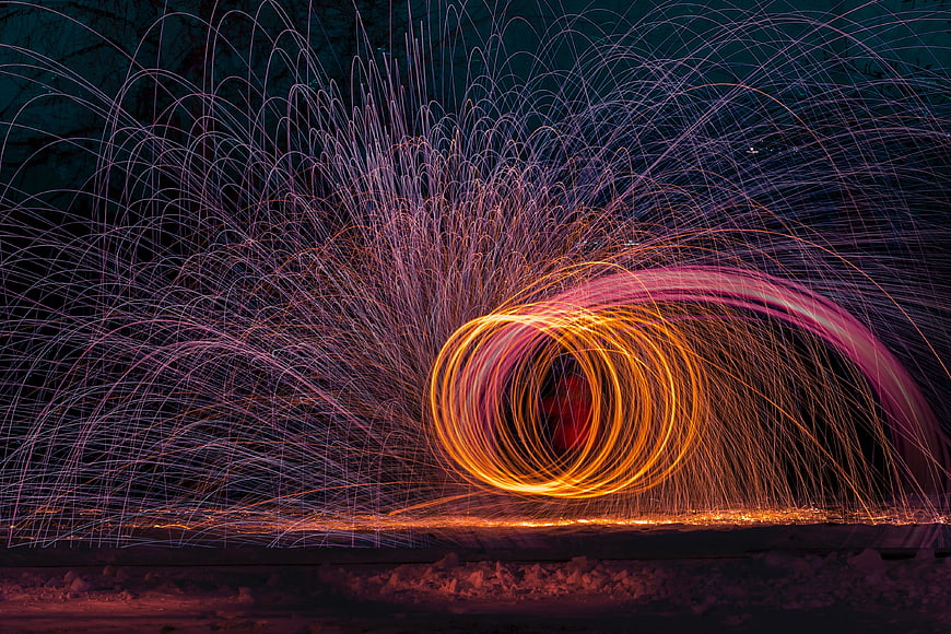 Steel wool spinning light painting sparks at night