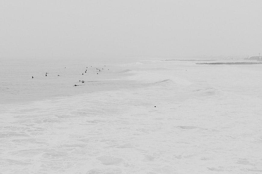 Surfers in Foggy Ocean Waves Black and White