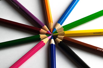 Colorful Colored Pencils Arranged In A Starburst Pattern On White Background