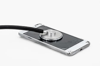 Broken Smartphone with Stethoscope on White Background