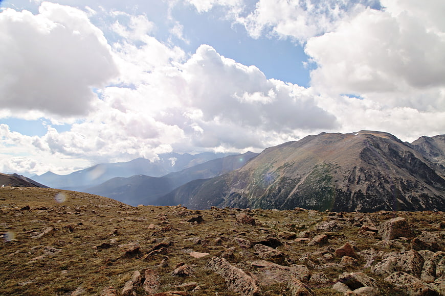 Rugged Rocky Mountain Landscape with Cloudy Sky