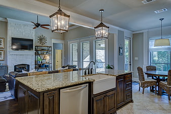 Modern farmhouse kitchen with granite island and farmhouse sink