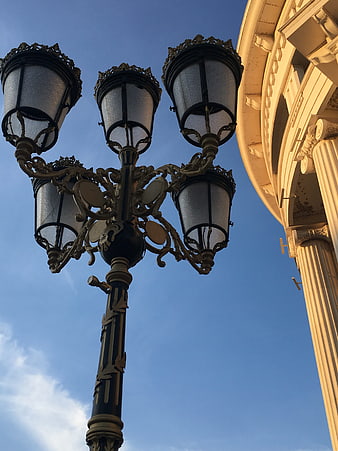 Ornate Vintage Street Lamp Against Blue Sky
