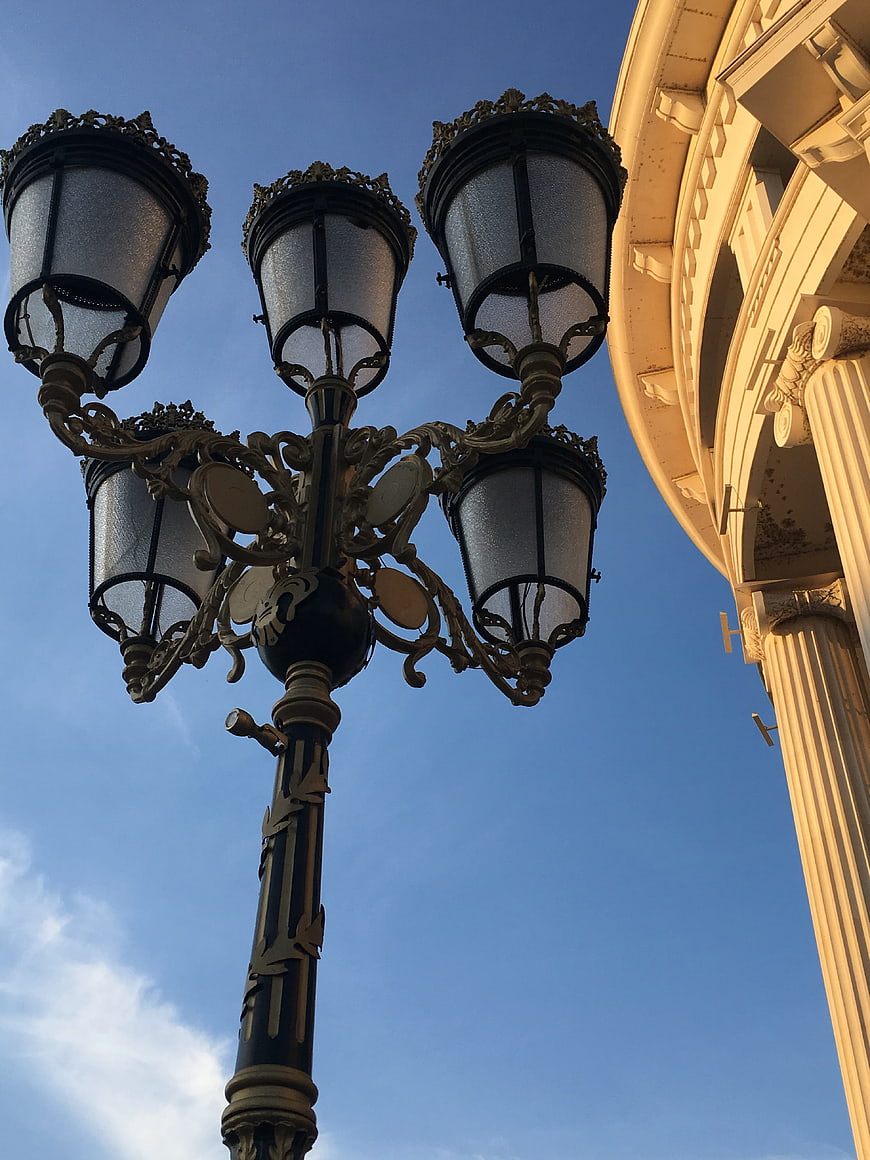 Ornate Vintage Street Lamp Against Blue Sky
