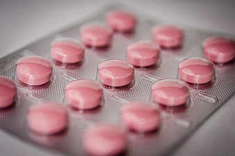 Close-up of pink pills in a blister pack