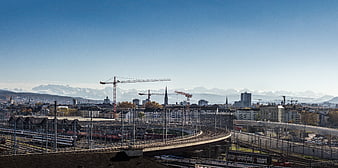 Panoramic View of Zurich Railway Station with Alps