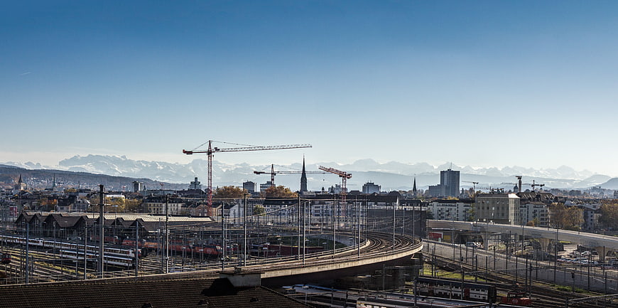Panoramic View of Zurich Railway Station with Alps