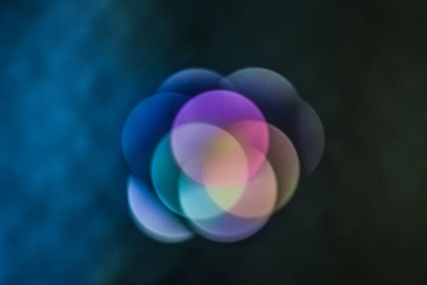 Abstract colorful bokeh light circles on dark background