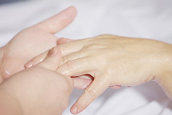 Close-up of hands receiving a relaxing massage treatment
