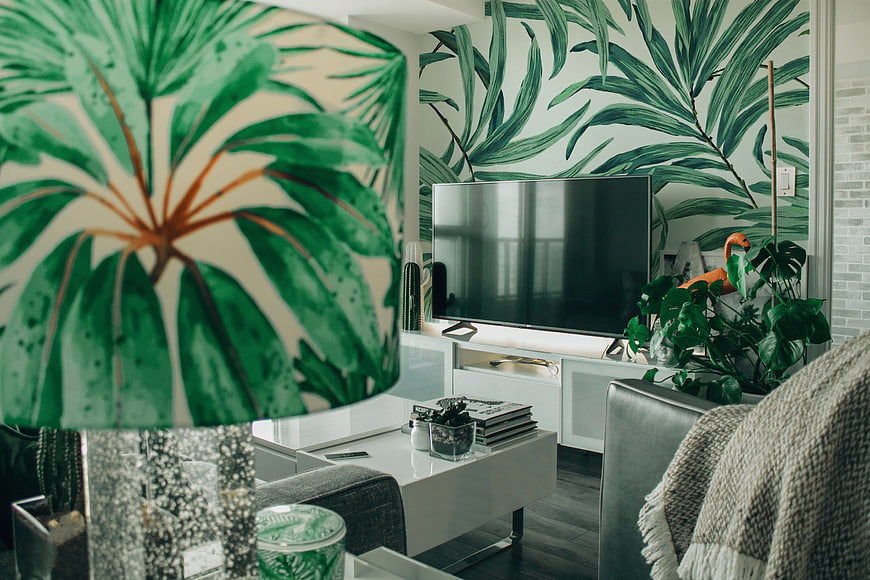 Modern Living Room with Tropical Leaf Wallpaper and Green Plants