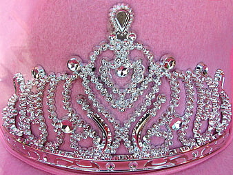 Silver Rhinestone Tiara on Pink Velvet Background