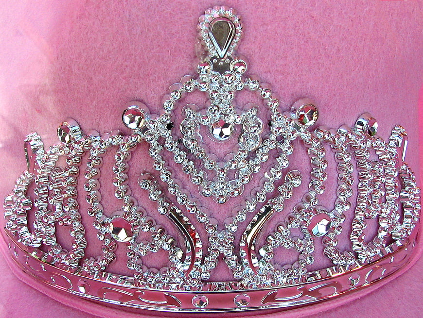 Silver Rhinestone Tiara on Pink Velvet Background