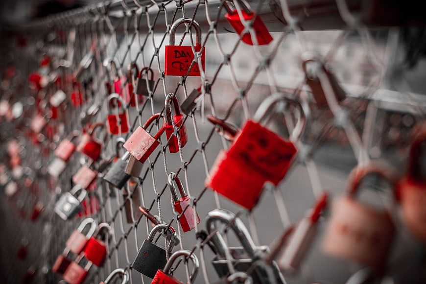 Red Love Locks on Chain Link Fence