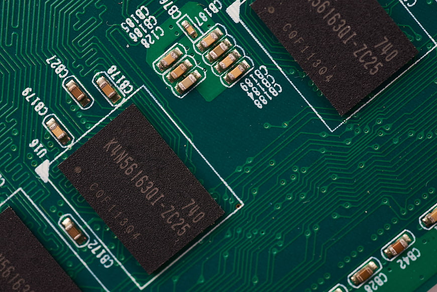 Macro shot of green circuit board with electronic chips