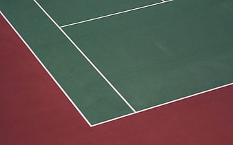 Green and red tennis court surface with white lines