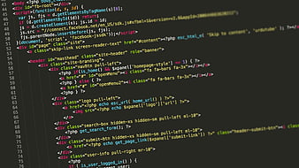 Close-up of PHP and HTML code on dark screen