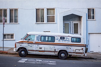 Vintage White RV Parked on Urban Street