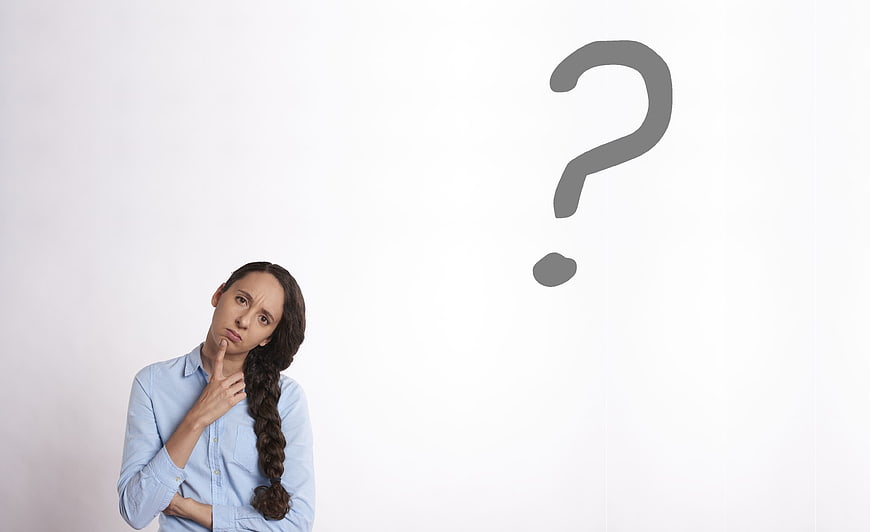 Confused woman thinking with question mark on white background