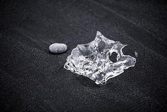 Crystal Clear Ice Shard on Black Sand Beach