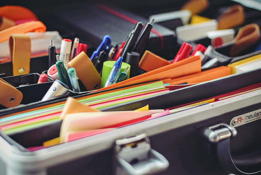 Colorful Office Supplies in Open Briefcase