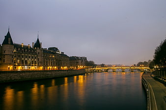 Paris Seine River Twilight with Conciergerie and Bridge