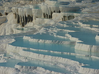 Turquoise pools in white travertine terraces at Pamukkale