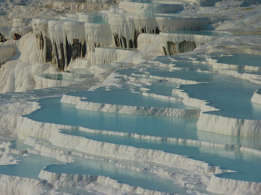 Turquoise pools in white travertine terraces at Pamukkale