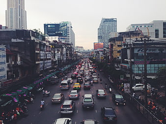 Busy Bangkok Traffic Street Scene with Cars and Motorcycles