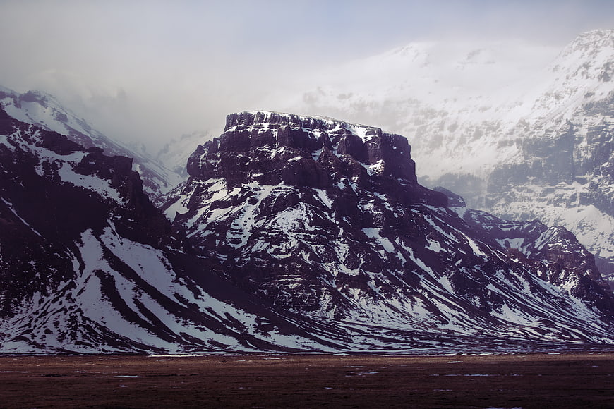 Dramatic Snow-Capped Mountain Peak in Winter Landscape