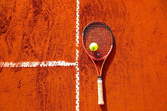 Tennis Racket and Ball on Clay Court Flat Lay