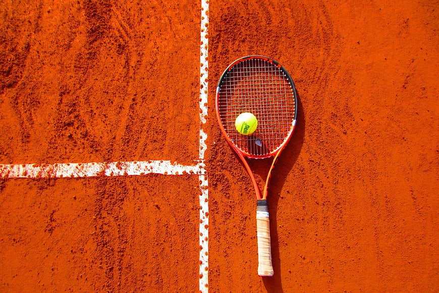 Tennis Racket and Ball on Clay Court Flat Lay