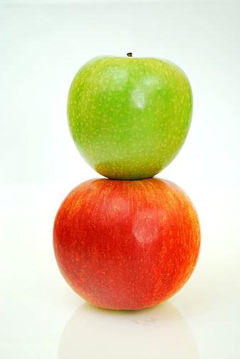 Stacked Red and Green Apples on White Background
