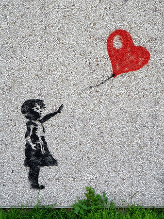 Street art mural of girl reaching for red heart balloon