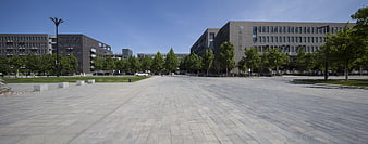 Wide View of Modern University Campus Plaza with Paved Walkway