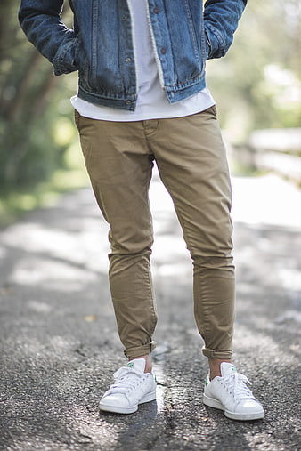 Man in Denim Jacket and Khaki Pants on Road