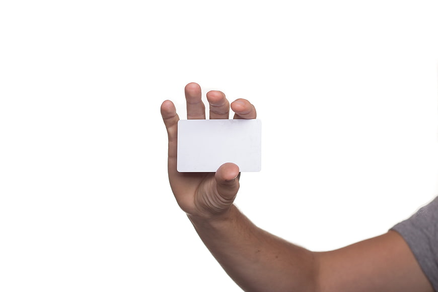Hand Holding Blank White Business Card on White Background