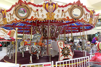 Colorful Indoor Carousel with Horses and Zebras