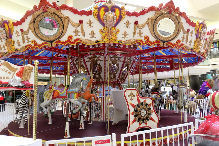 Colorful Indoor Carousel with Horses and Zebras