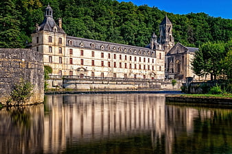 Historic Abbey Architecture Reflected in Calm Water