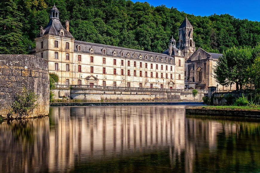 Historic Abbey Architecture Reflected in Calm Water