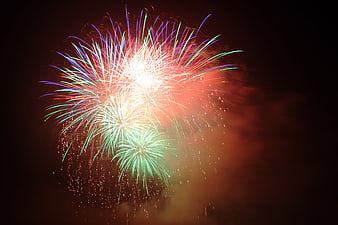 Colorful Fireworks Bursting In Dark Night Sky