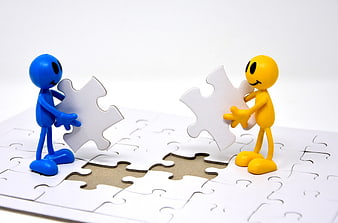 Blue and yellow figures holding puzzle pieces over a gap