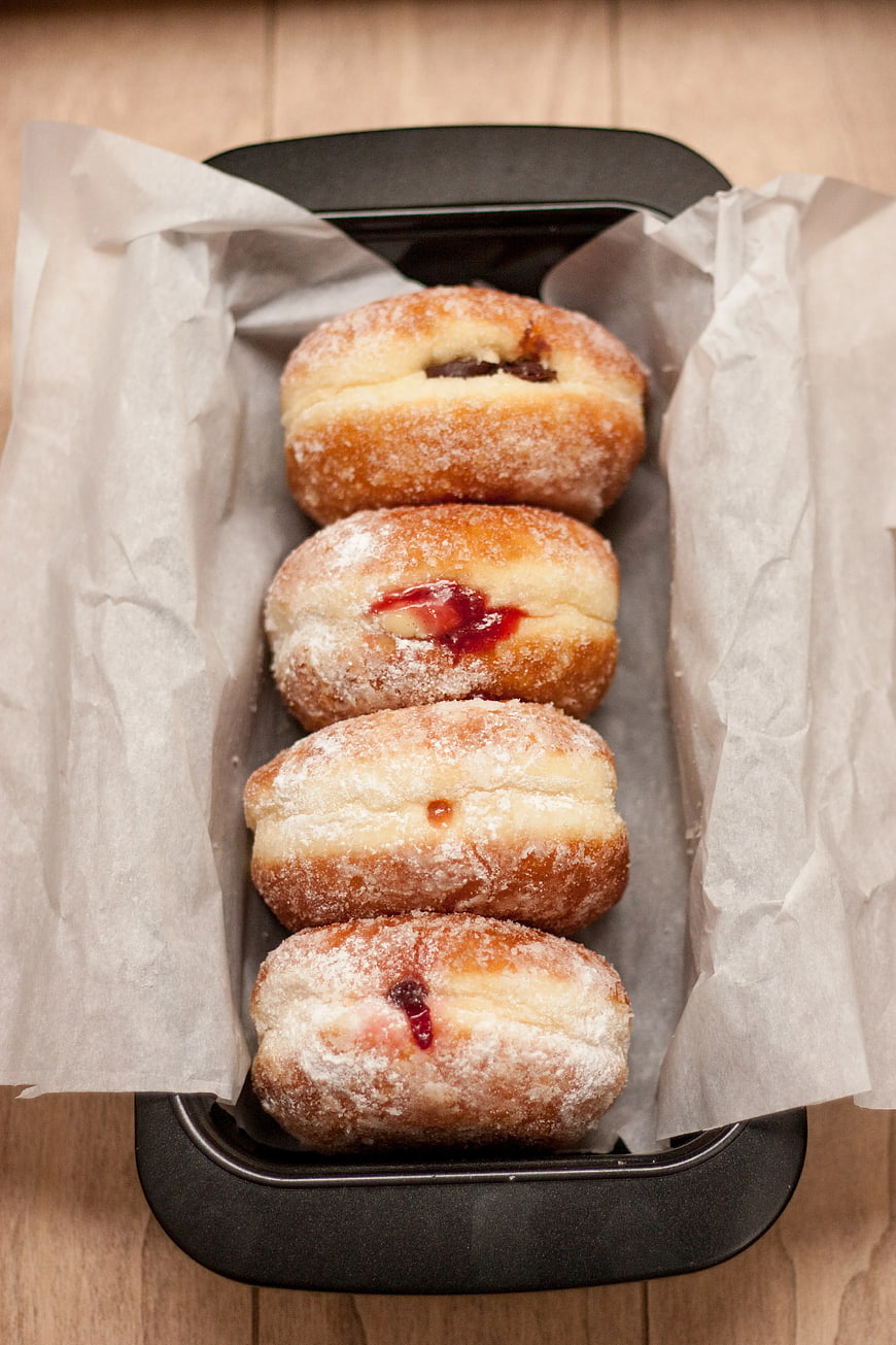 Freshly Baked Jam-Filled Donuts in Black Tray