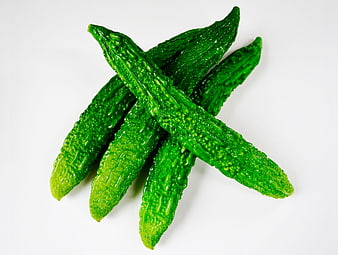 Fresh Green Bitter Melons Arranged on White Background