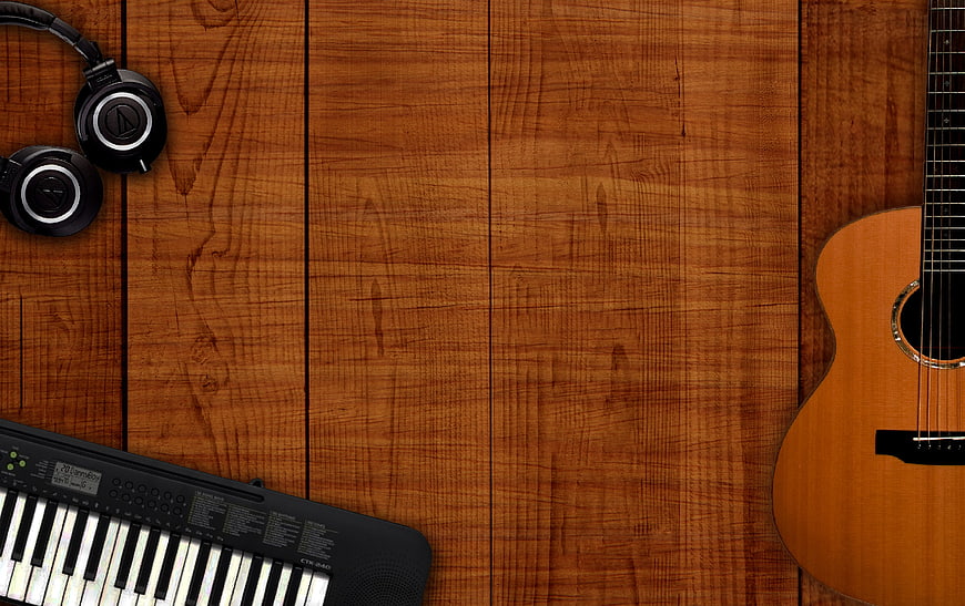 Music instruments on wooden background with copyspace